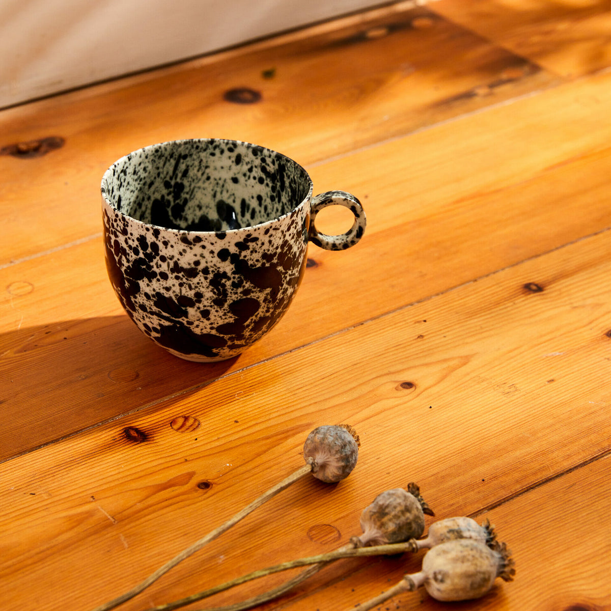 black-splatter-mug-ceramic-drips-cup-inky-drops-pottery
