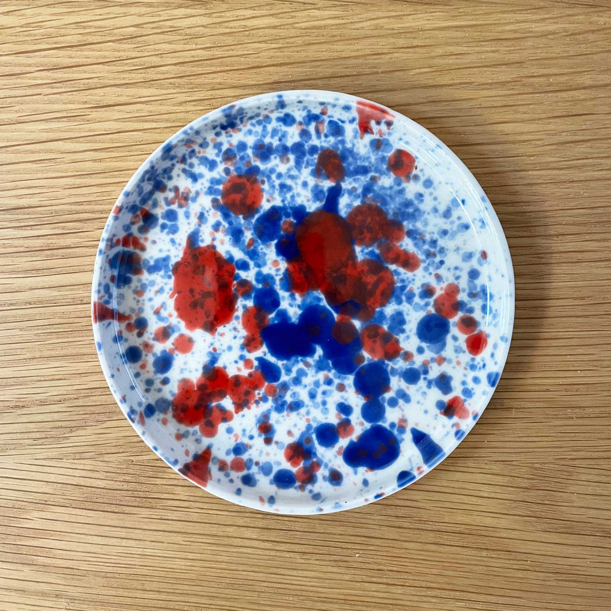blue-and-red-splatter-plate