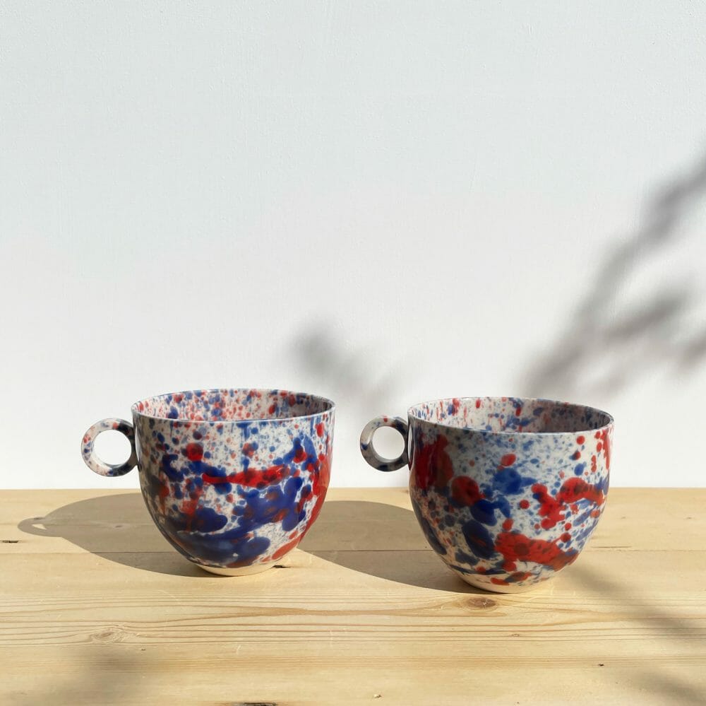 blue-and-red-splatter-mug-drips-splashes-colour-pottery-cup-circle-handle