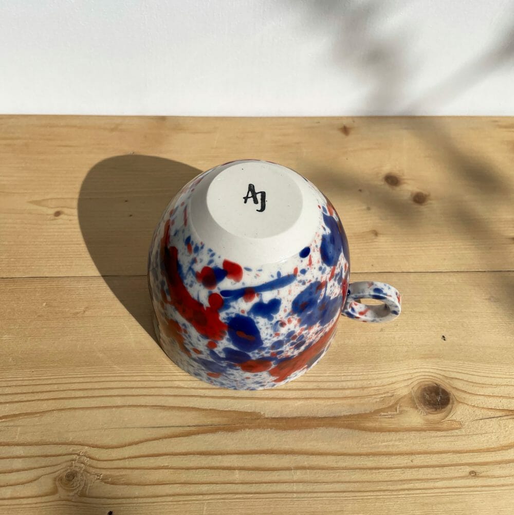 blue-and-red-splatter-mug-drips-splashes-colour-pottery-cup-circle-handle